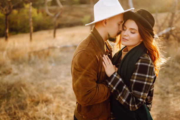 istock Young couple walking in the autumn park. 1344811944