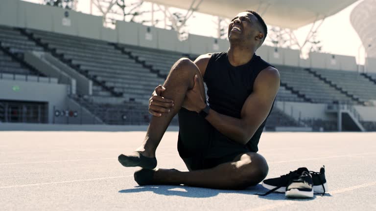 4k video footage of an athlete suffering from a sports injury while training on the track