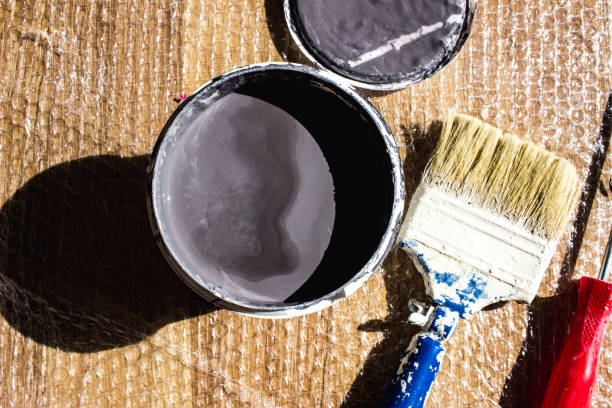 istock Painting materials lying on ground home renovation 1344813068