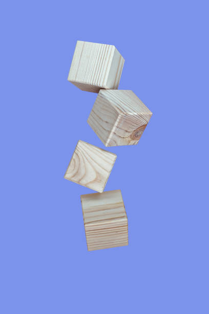 istock Wooden cubes floating on purple background 1344814746