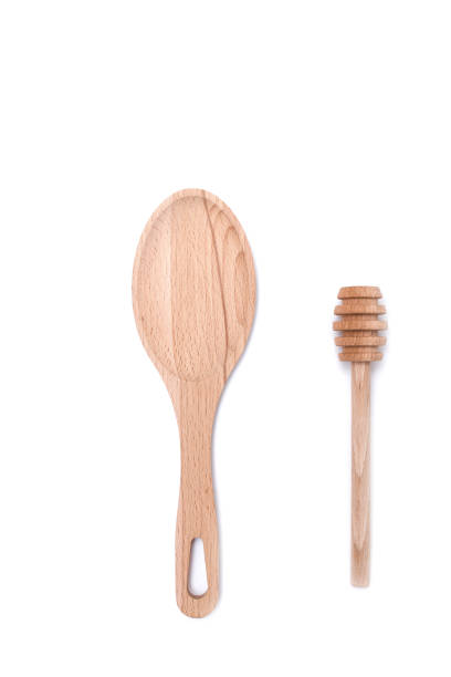 istock wooden spoon and honey dipper 1344817097