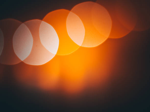 istock Background, wallpaper with black-orange bokeh 1344817326