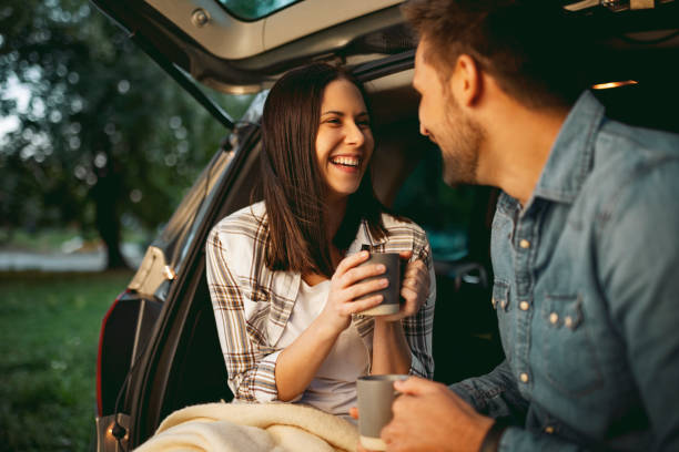 istock Sitting in car trunk drinking coffee 1344819589