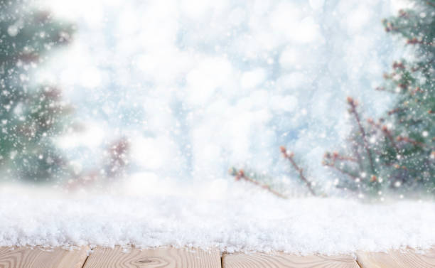 istock Christmas background with wooden tabletop with snow 1344819779