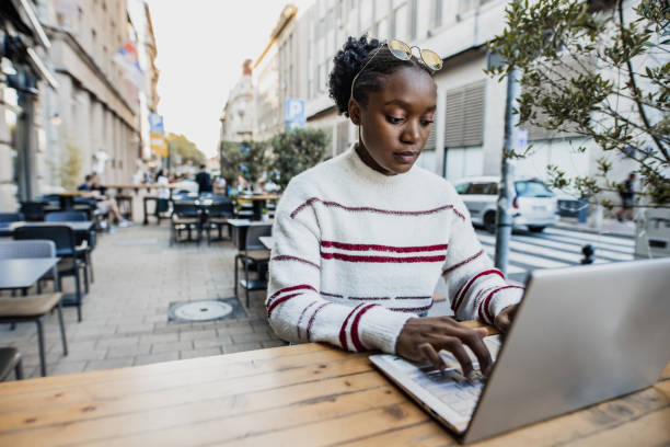 istock Young woman remotely from a cafe 1344820045