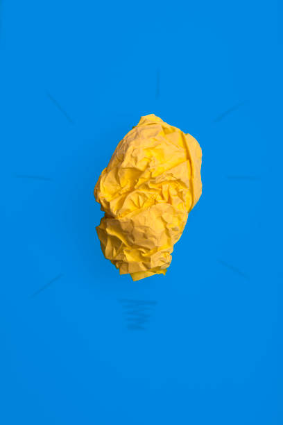 istock Creativity inspiration,ideas concepts with lightbulb from paper crumpled ball 1344820814