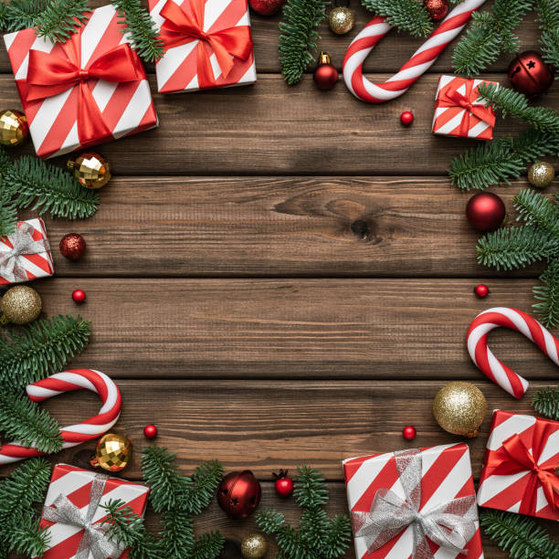 christmas background with a decorative frame made of gift box and fir branch - fir branch imagens e fotografias de stock