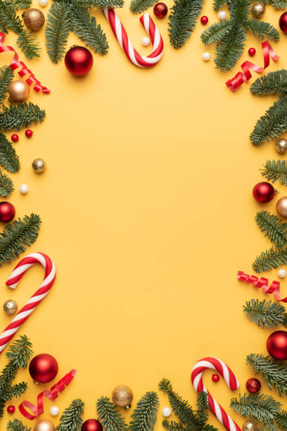 istock Christmas card with holiday frame on yellow background 1344821550