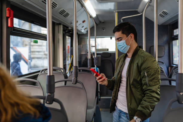 istock Man travelling alone in the public bus during Covid-19 quarantine 1344825534