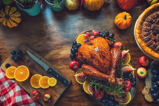 istock Preparing Stuffed Turkey with Side Dishes for Holidays 1344827093