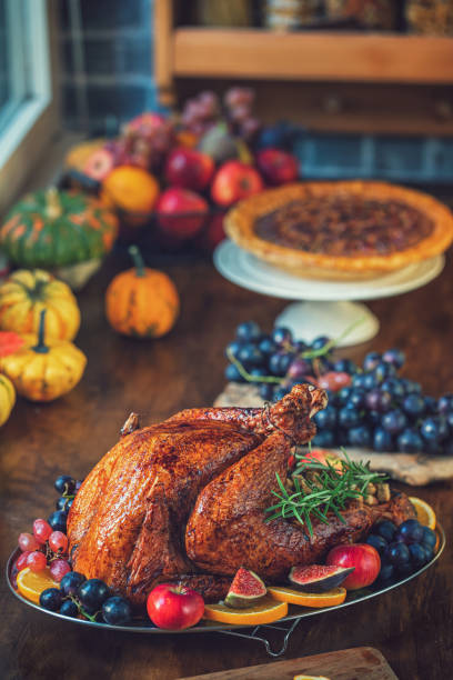 istock Preparing Stuffed Turkey with Side Dishes for Holidays 1344827106