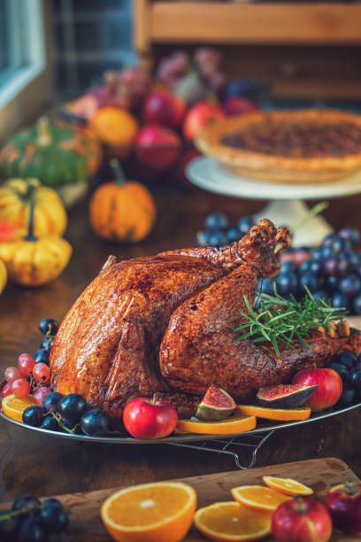 istock Preparing Stuffed Turkey with Side Dishes for Holidays 1344827107