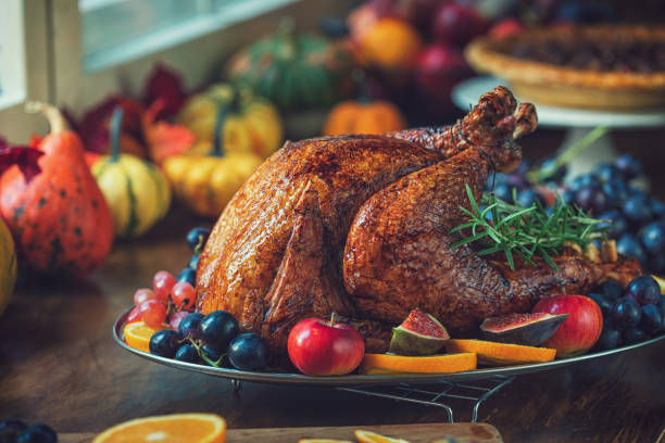 istock Preparing Stuffed Turkey with Side Dishes for Holidays 1344827109
