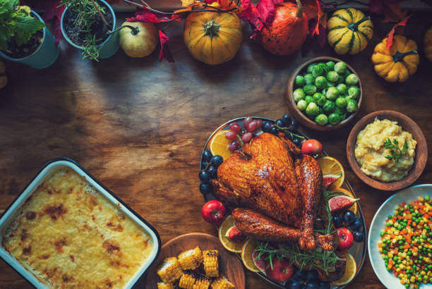 istock Preparing Stuffed Turkey with Side Dishes for Holidays 1344827122