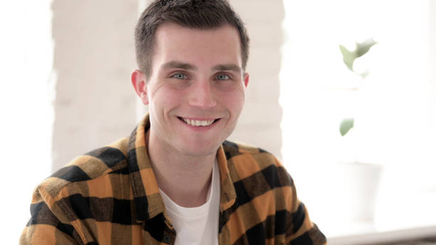 istock Smiling Casual Young Man Looking at Camera 1344827736