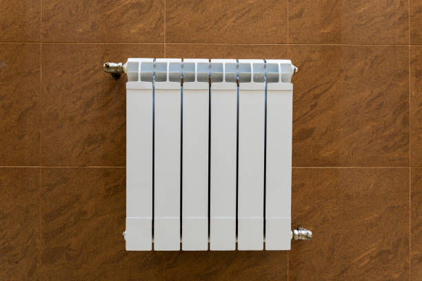 istock modern sectional radiator for heating the heating system on the wall, warmth and comfort in the house 1344827769