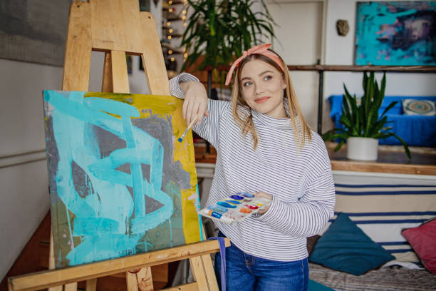 istock Portrait of a young female artist in studio 1344827770