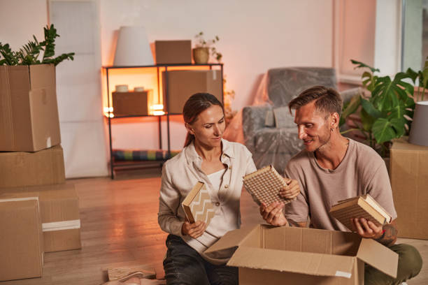 istock Happy Couple Unpacking in New Home 1344828061
