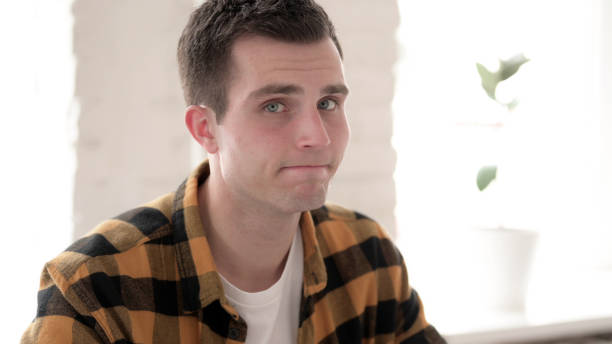 istock Rejecting Casual Young Man Shaking Head in Denial 1344828070