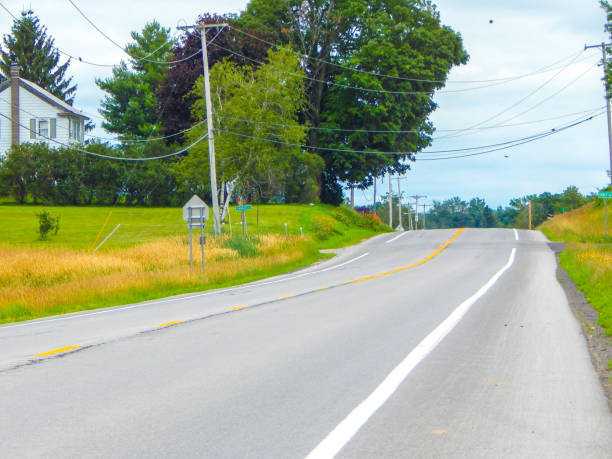 istock Road in rural area with trees 1344832047