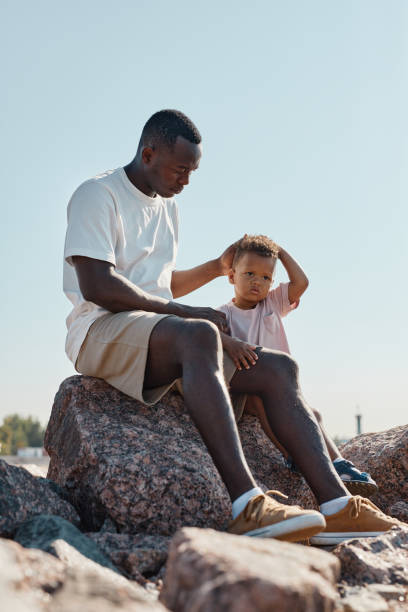 istock Young Father with Baby Son Outdoors 1344832135