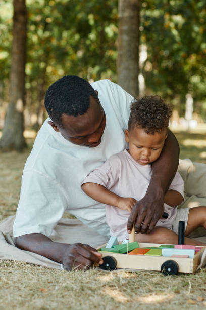 istock Happy Father with Little Son in Park 1344832138