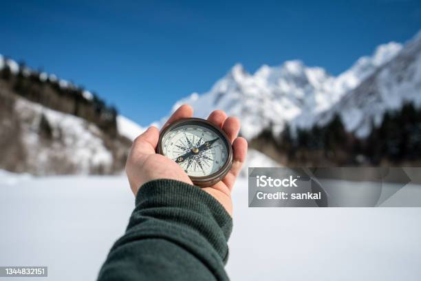 Searching The Way Stock Photo - Download Image Now - Navigational Compass, Mountain, Hand