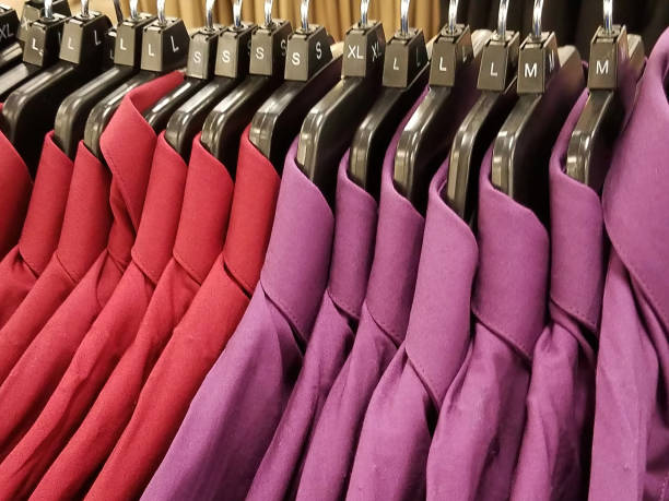 istock Hanging Red And Purple Retail Shirts 1344833128