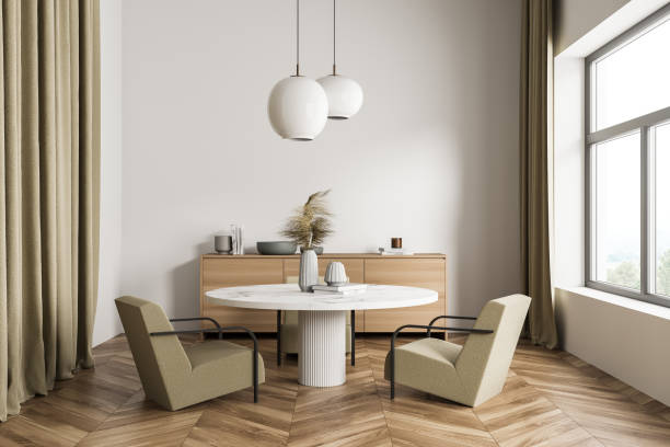 istock Bright dining room interior with large window with countryside view 1344834627