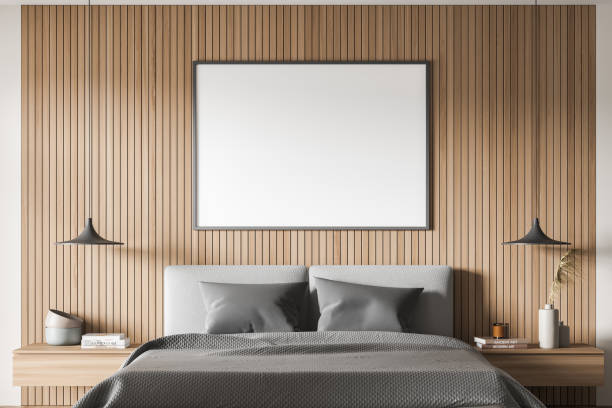 istock Banner with wall panelling, pendant lamps and grey bed. Close-up view. 1344835966