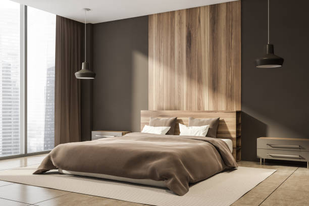 istock Dark bedroom interior with large bed and panoramic window 1344836725