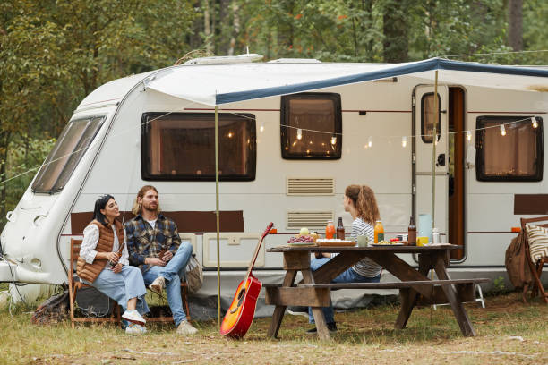 istock Friends Relaxing by RV Van 1344837033