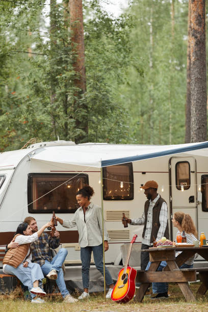 istock Friends Relaxing by RV Van Outdoors 1344837044