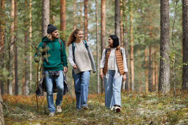Young People Hiking in Forest