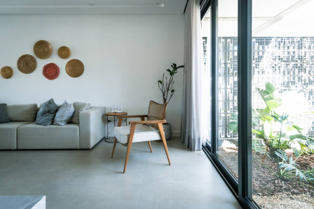 istock Living room with beautiful chair and sofa with pillows 1344838106