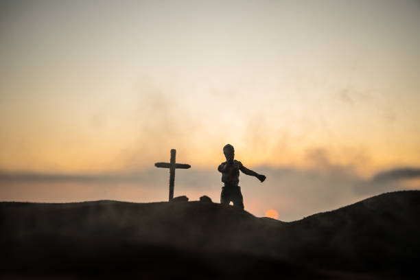 istock Silhouette some zombies on the cemetery walking around at sunset. Selective focus 1344840049
