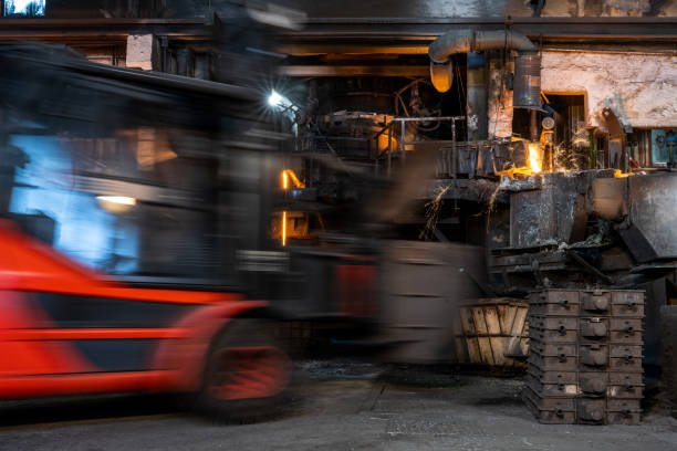 istock Motion blurred view of forklift transporting container with material in industrial factory 1344841160