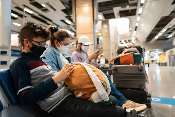 Photo of Tourists at the airport with luggage