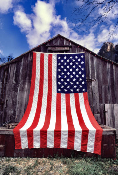 istock American Flag covering a barn 1344849149