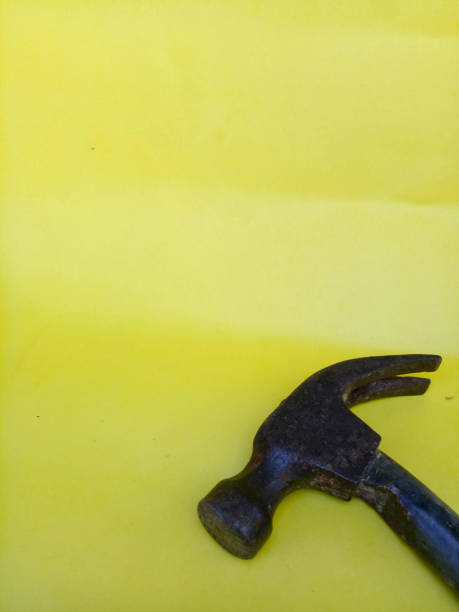 istock Stone Head Hammer isolated on a yellow background 1344849457