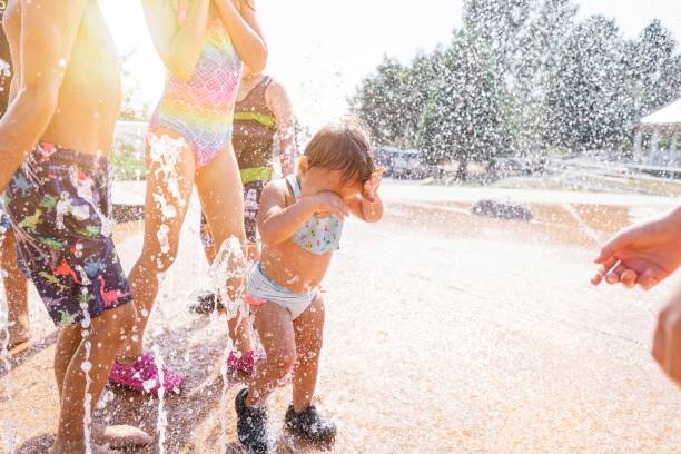 istock Kids playing at water park 1344850684