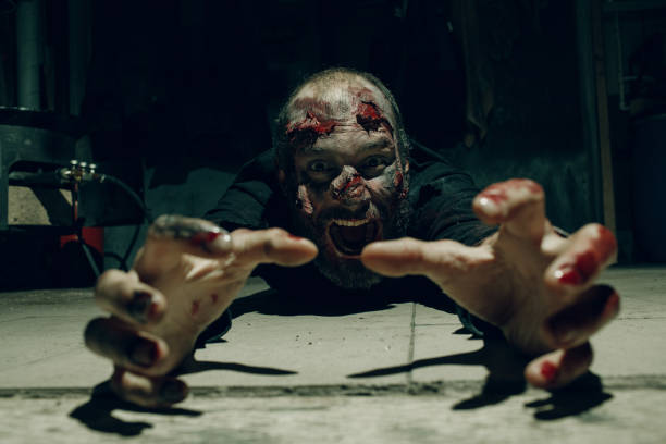 istock Zombie man lying on floor. Halloween party concept. 1344850837