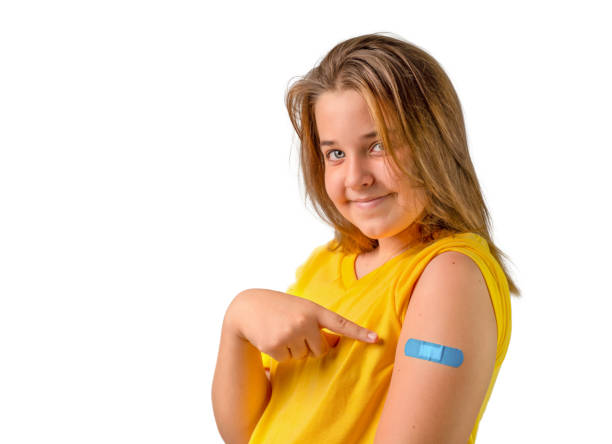 istock Girl showing vaccination site isolated 1344851853