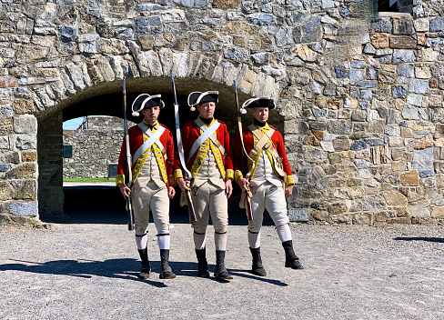 Ticonderoga, New York, USA - September 02, 2021: Soldiers are a part of  historical reenactment at Fort Ticonderoga. Fort Ticonderoga is a large 18th-century star fort built by the French at a narrows near the south end of Lake Champlain, New York,  USA.