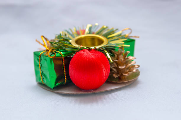 Christmas themed candle holder on a white background