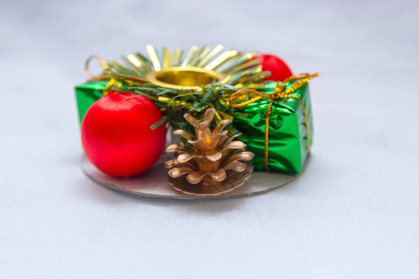 istock Christmas themed candle holder on a white background 1344853513