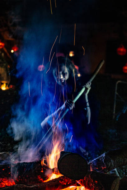 istock Witch portrait at a fireplace on a Halloween night 1344856222