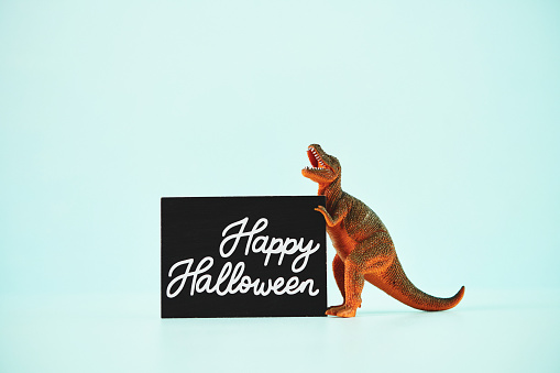 Dinosaur with Happy Halloween Sign