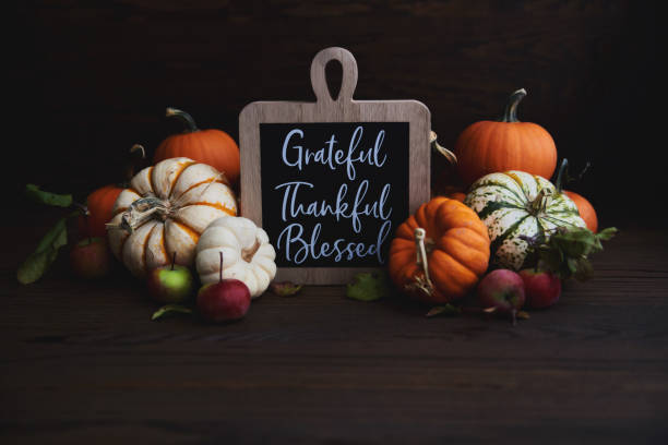 istock Thanksgiving Arrangement with Assorted Pumpkins and Crabapples on Rustic Wood 1344858274