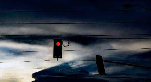 istock Red traffic light in the sunset 1344859941